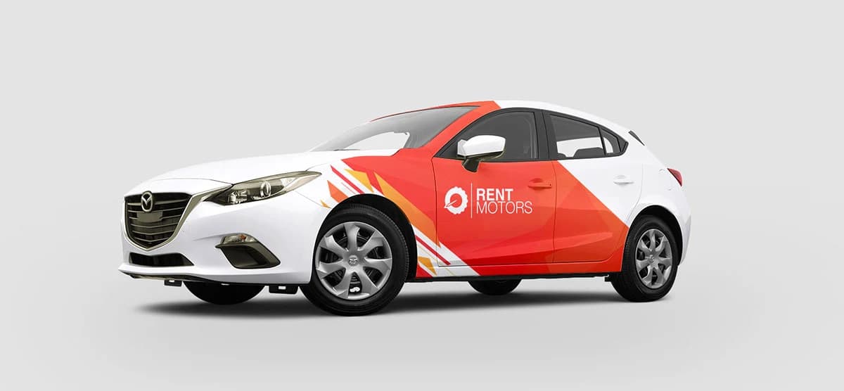 Same Mazda hatchback after a red and orange Rent Motors wrap design