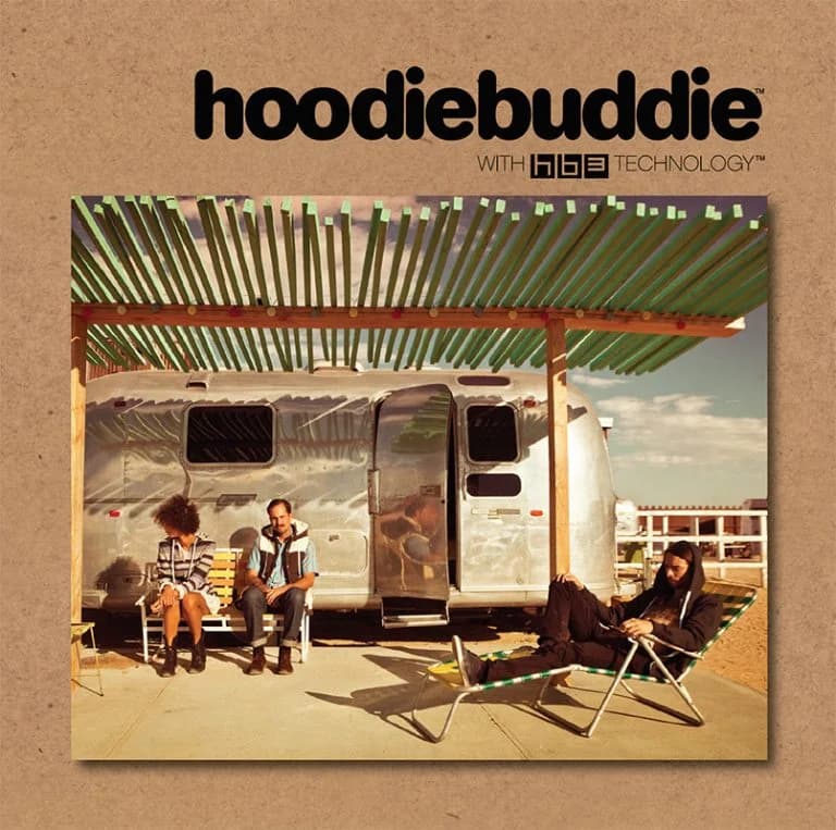 Hoodiebuddie brochure cover with three people relaxing beside a vintage trailer