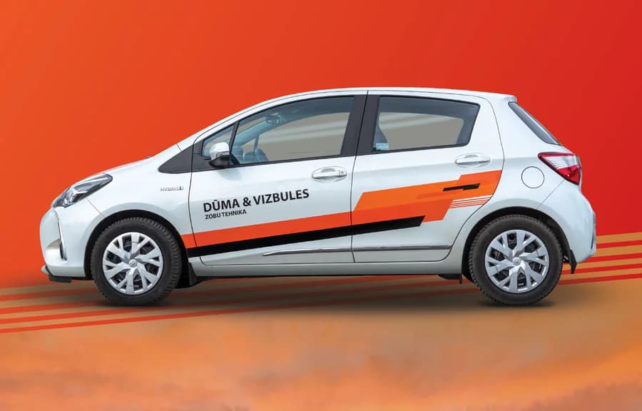 Dūma & Vizbules orange vehicle wrap design