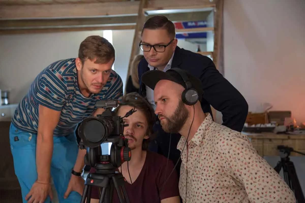 Crew reviewing a shot together on a camera monitor