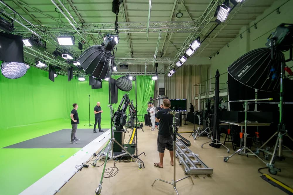 Robotic camera arm on set at a large-scale commercial video production