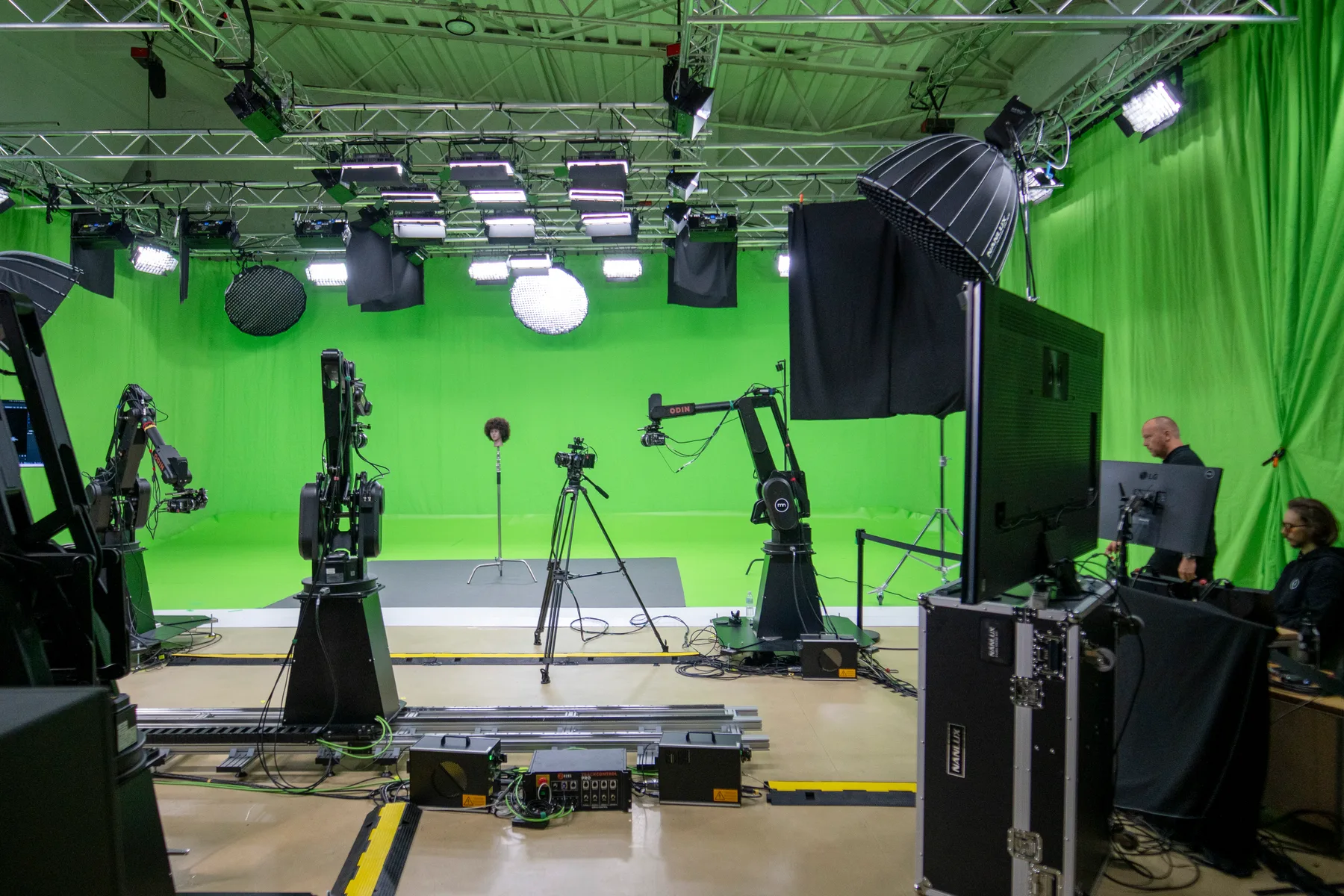 Multi-camera live production control desk with vision-mixing and monitoring displays